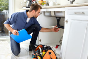 Landlord checking drains